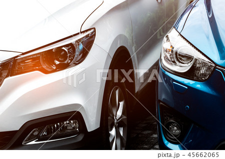 Close up headlamp light of blue and white SUV car 45662065