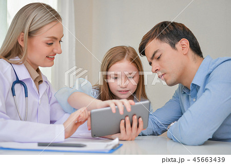 Health Concepts. The doctor is examining the health of the child 45663439