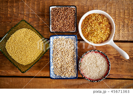 top view of several types of porridge in different bowls on an wooden table top view of several types of porridge in different bowls on an wooden table 45671363