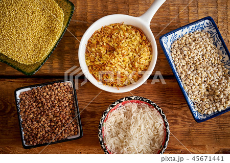 top view of several types of porridge in different bowls on an wooden table top view of several types of porridge in different bowls on an wooden table 45671441