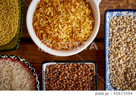 top view of several types of porridge in different bowls on an wooden table 45671494