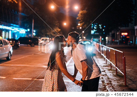 Young couple in the streets of the evening city 45672544
