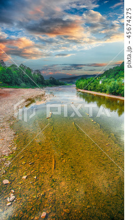 stream of water in the rocks with sky and mirror stream of water in the rocks with sky and mirror 45674275