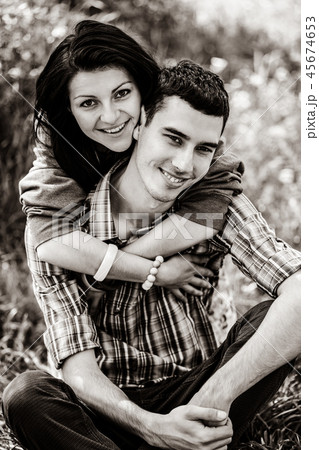 copule of man and woman on grass in a park 45674653