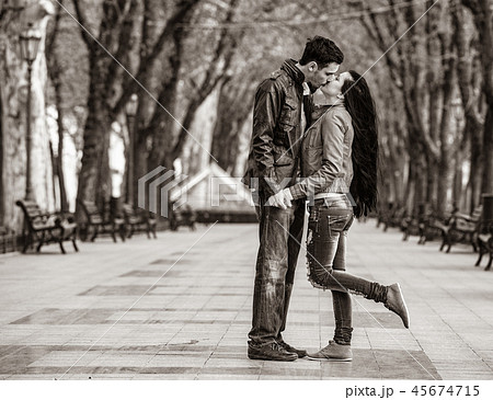 Young couple man and woman kissing on the city street. 45674715