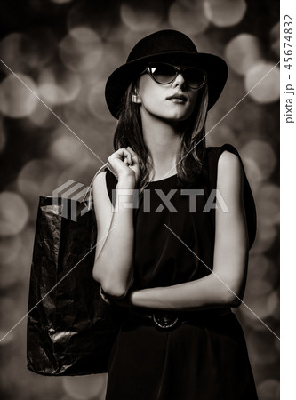 woman holding a shopping bag woman holding a shopping bag 45674832