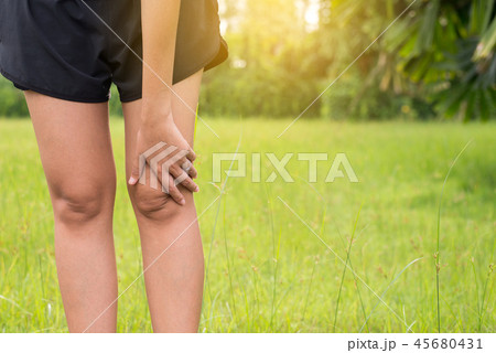Woman suffering from pain in leg and knee injury 45680431
