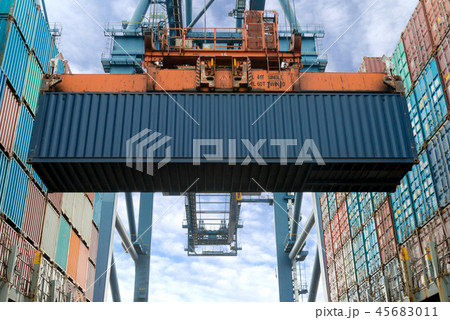 Crane loading Containers in freight ship. 45683011