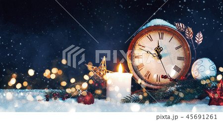 New Year's clock. Decorated with balls, star and tree on snow 45691261