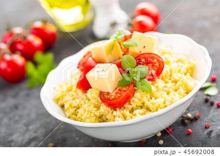 Millet porridge with tomatoes and cheese Millet porridge with tomatoes and cheese 45692008