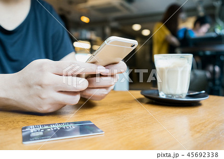 woman using smartphone for mobile transaction 45692338