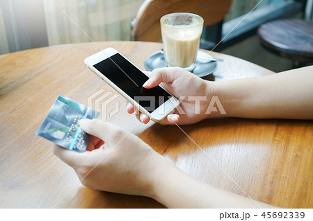 woman using smartphone for online shopping woman using smartphone for online shopping 45692339