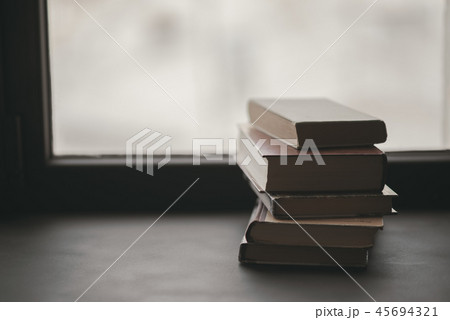 Books on the window 45694321