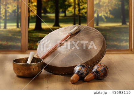 A still life of the shamanic drum, Tibetan bowls A still life of the shamanic drum, Tibetan bowls 45698110