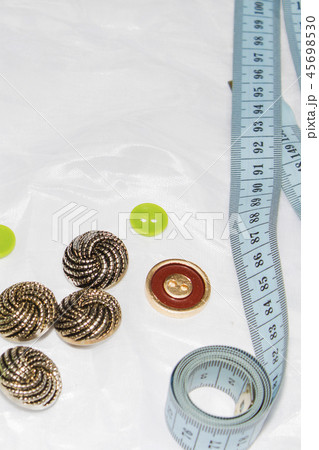 Background of sewing: thread, measuring tape Background of sewing: thread, measuring tape 45698530