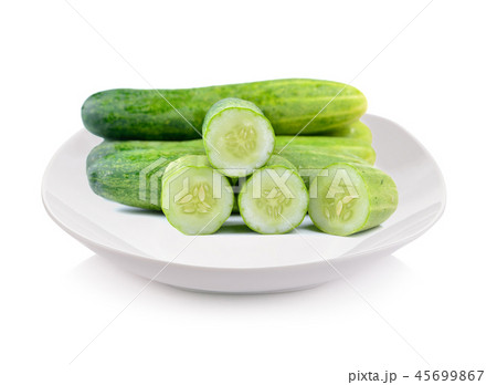 sliced cucumber on plate  isolated on white 45699867