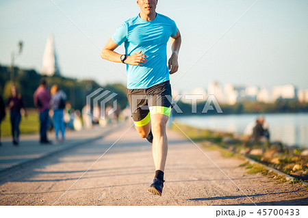 Photo of running sportsman at promenade Photo of running sportsman at promenade 45700433