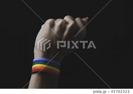woman with a rainbow-patterned ribbon in his wrist 45702323