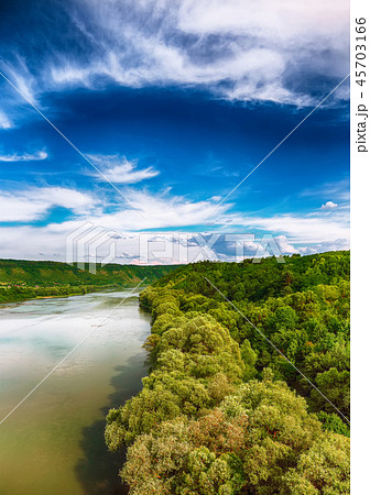 Beautiful clouds in the sky over the river. Beautiful clouds in the sky over the river. 45703166