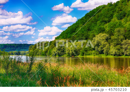 Beautiful clouds in the sky over the river. Beautiful clouds in the sky over the river. 45703210