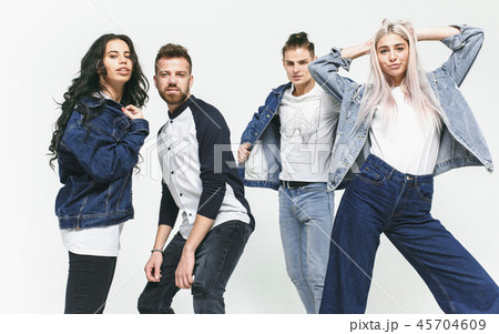 Group of smiling friends in fashionable jeans Group of smiling friends in fashionable jeans 45704609