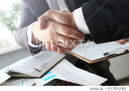 Man in suit shake hand as hello in office 45705289