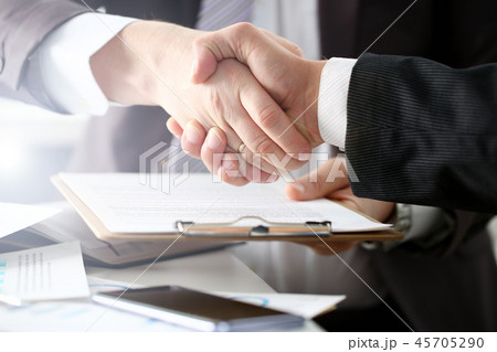 Man in suit shake hand as hello in office 45705290