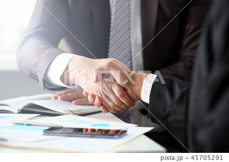 Man in suit shake hand as hello in office 45705291