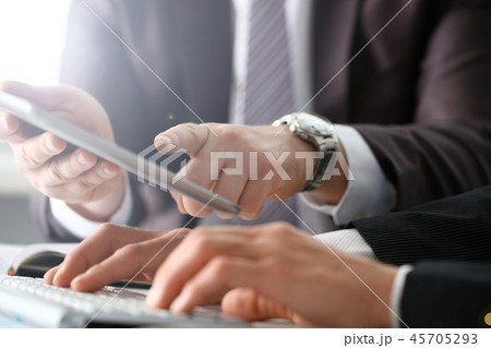 Two businessman are looking and 45705293
