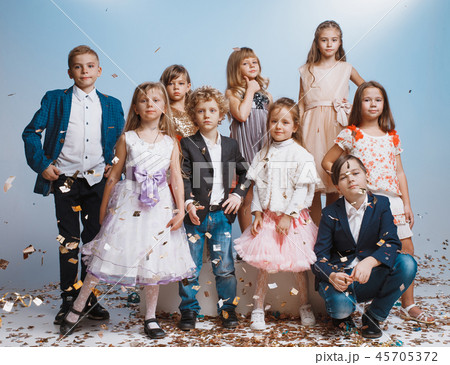 Adorable kids have fun together, throw colourful confetti, Adorable kids have fun together, throw colourful confetti, 45705372