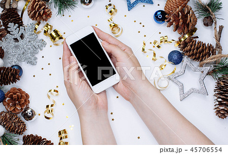 Female hands holding smart mobile phone on white 45706554