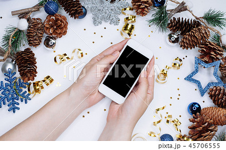 Female hands holding smart mobile phone on white 45706555