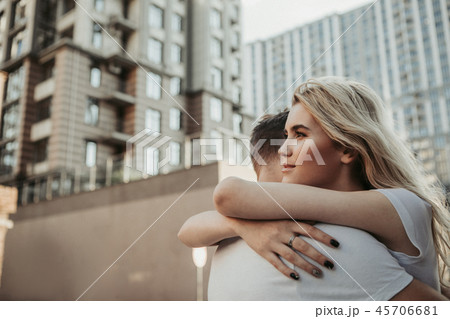 Peaceful looking girl hugging her male partner Peaceful looking girl hugging her male partner 45706681