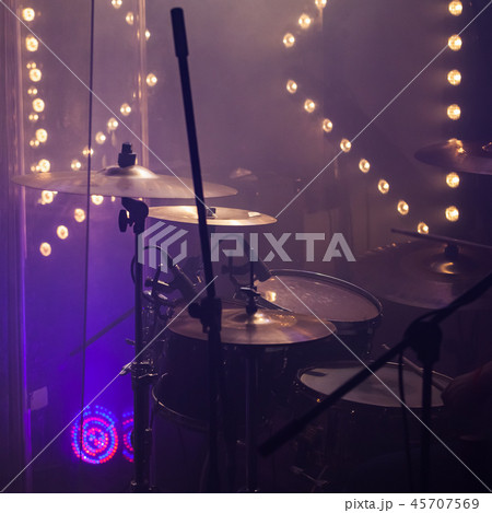 Cymbals in stage lights. Close-up square photo 45707569