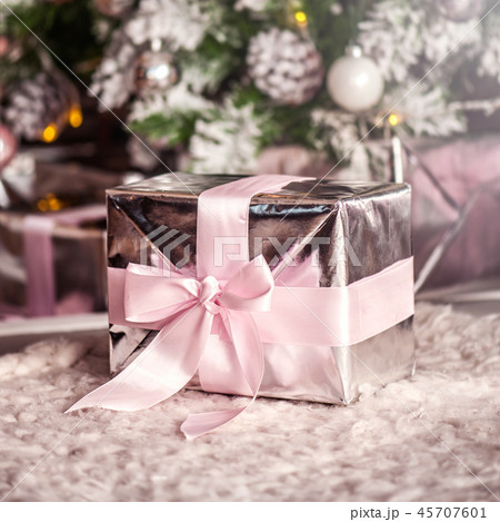 decorations on Christmas tree and glare of lights 45707601