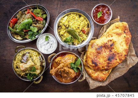 Traditional Indian Curries and Biryani with Mango  45707845