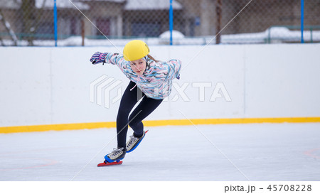 Speed skating young girl on training rink 45708228