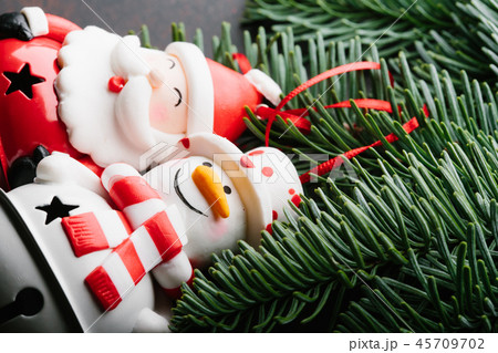 Christmas New Year holiday background. Santa Claus , snowman, and branch tree on dark background Christmas New Year holiday background. Santa Claus , snowman, and branch tree on dark background 45709702