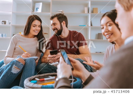 Pleasant four friends having fun Pleasant four friends having fun 45713406