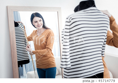 Reflection of a positive young woman 45714779