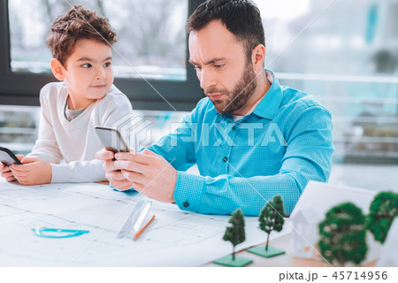 Cute boy looking at his dad 45714956