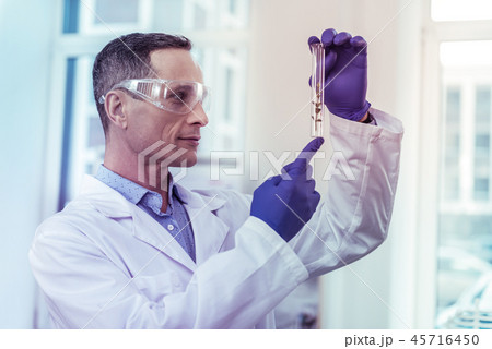 Close up of professional worker that staring at sample Close up of professional worker that staring at sample 45716450