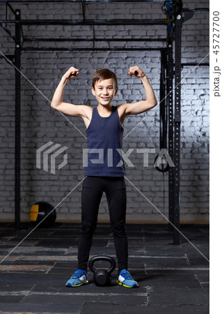 Training and sport. Kid in crossfit gym. Healthy lifestyle. Training and sport. Kid in crossfit gym. Healthy lifestyle. 45727700