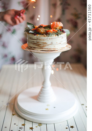 christmas cake against the background of bingalian lights, christmas mood christmas cake against the background of bingalian lights, christmas mood 45731360