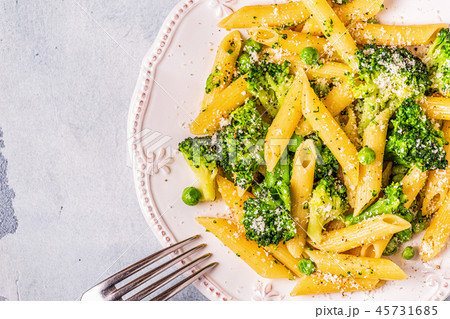 Pasta with broccoli, green peas, garlic, cheese. Pasta with broccoli, green peas, garlic, cheese. 45731685