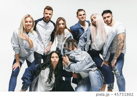 Group of smiling friends in fashionable jeans Group of smiling friends in fashionable jeans 45731802