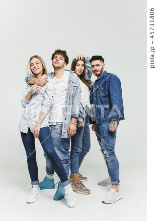 Group of smiling friends in fashionable jeans Group of smiling friends in fashionable jeans 45731806