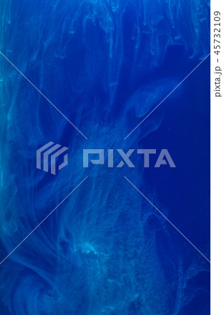 Abstract pattern falling into the water drop of blue ink - cyan ink dissolved in water 45732109