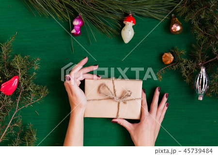 women's hands at the Christmas background Christmas tree holiday new year gifts 45739484