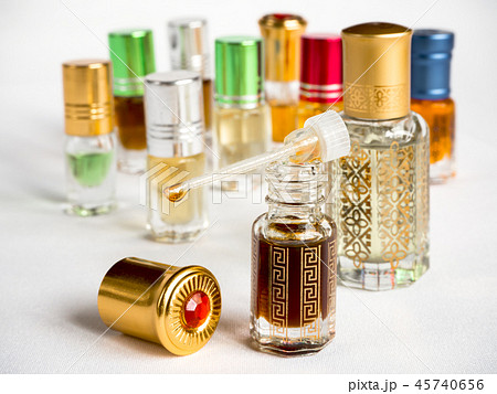 Shot of arabian oud oil in a glass jar.  45740656